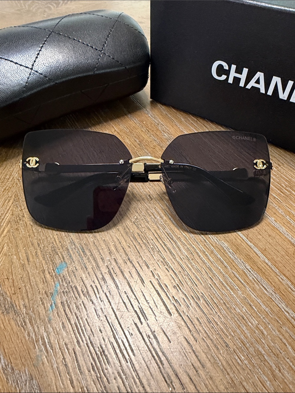 CHANEL Black Rimless Square Sunglasses with Gold Accents - Picture 2 of 9